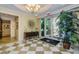 Elegant lobby with decorative rug, table and chandelier at 331 Cleveland St # 402, Clearwater, FL 33755