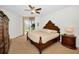 Cozy main bedroom with a balcony, a ceiling fan, and tasteful decor at 331 Cleveland St # 402, Clearwater, FL 33755