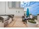 Outdoor grill area with BBQ grill, ample counter space, and comfortable seating with water views at 331 Cleveland St # 402, Clearwater, FL 33755