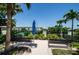 Scenic outdoor area with a peaceful view, bench seating, and lush landscaping at 331 Cleveland St # 402, Clearwater, FL 33755