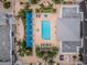 Aerial view of a pristine pool, lush landscaping, and stylish architectural design at 331 Cleveland St # 402, Clearwater, FL 33755