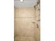 Shower stall tiled with marble-like ceramic and featuring mounted and handheld shower heads at 331 Cleveland St # 402, Clearwater, FL 33755