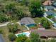 Overhead image of home highlighting the surrounding greenery, landscaping and outdoor space at 34477 Poinsettia Pl, Dade City, FL 33523