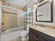 Bathroom featuring a shower/tub combo, a granite vanity and neutral colors at 34477 Poinsettia Pl, Dade City, FL 33523