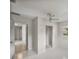 Bedroom featuring neutral walls, tiled floors, ceiling fan and a closet at 34477 Poinsettia Pl, Dade City, FL 33523