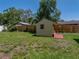 Easy access storage shed in backyard, built on a patio, for secure storage at 34477 Poinsettia Pl, Dade City, FL 33523