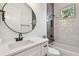 Bathroom featuring white cabinets with a black faucet, plus tub with shower at 3455 17Th S Ave, St Petersburg, FL 33711