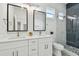 Bathroom featuring double sinks with marble countertops, sleek tile, and modern fixtures at 3455 17Th S Ave, St Petersburg, FL 33711