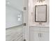 Bathroom features white vanity, modern mirror, and neutral color scheme at 3455 17Th S Ave, St Petersburg, FL 33711