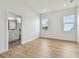 A bright bedroom leads to a modern bathroom, complete with vinyl flooring and natural light at 3455 17Th S Ave, St Petersburg, FL 33711
