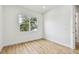 Bright bedroom with hardwood floors and a large window at 3455 17Th S Ave, St Petersburg, FL 33711