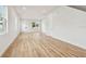 Spacious, airy bonus room with modern wood flooring, two windows, and white trim and walls at 3455 17Th S Ave, St Petersburg, FL 33711