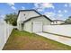 Home exterior view, showcasing a two-car garage and privacy fence around the property at 3455 17Th S Ave, St Petersburg, FL 33711