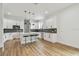 Bright, modern kitchen with white cabinetry, stainless steel appliances, and a center island with seating at 3455 17Th S Ave, St Petersburg, FL 33711
