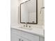 Contemporary powder room featuring a sleek mirror and pristine marble countertop at 3457 17Th S Ave, St Petersburg, FL 33711