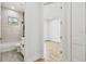 Bright bathroom featuring decorative accent wall tile, shower-tub combination, and undermount sink with modern fixtures at 3457 17Th S Ave, St Petersburg, FL 33711