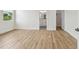 Bedroom with wood-look floors, leading to bath and closet for flexible living at 3457 17Th S Ave, St Petersburg, FL 33711
