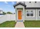 Inviting home entrance with modern door, manicured lawn, and visible address numbers at 3457 17Th S Ave, St Petersburg, FL 33711