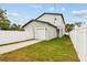 View of a detached garage with a driveway and a freshly cut lawn at 3457 17Th S Ave, St Petersburg, FL 33711