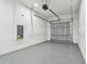 Spacious garage with epoxy flooring, insulated door and automatic opener offering secure and functional parking at 3457 17Th S Ave, St Petersburg, FL 33711