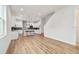 Open-concept living space featuring modern wood floors and a staircase at 3457 17Th S Ave, St Petersburg, FL 33711
