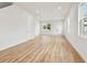 Bright living room featuring wood-look flooring and modern recessed lighting providing a clean and inviting space at 3457 17Th S Ave, St Petersburg, FL 33711