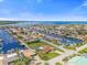 Expansive aerial view of waterfront community with canals, boats, and easy access to the ocean at 3506 Seaway Dr, New Port Richey, FL 34652