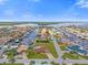 Gorgeous aerial view of waterfront homes with canals, docks, and boat access on a sunny day at 3506 Seaway Dr, New Port Richey, FL 34652