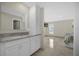 Primary bathroom vanity with granite countertop located off primary bedroom at 3506 Seaway Dr, New Port Richey, FL 34652