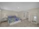 Bedroom featuring tile floors, neutral paint, a ceiling fan, and a view to the bathroom at 3506 Seaway Dr, New Port Richey, FL 34652