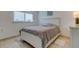 Bedroom with tile floors and a white bed frame at 3506 Seaway Dr, New Port Richey, FL 34652