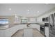 Well-equipped kitchen with granite counters, stainless steel appliances, and functional island space for cooking at 3506 Seaway Dr, New Port Richey, FL 34652