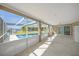 Enclosed lanai with a view of the pool and canal at 3506 Seaway Dr, New Port Richey, FL 34652