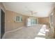 Screened lanai features tile floors, ceiling fan, and access to the pool area at 3506 Seaway Dr, New Port Richey, FL 34652