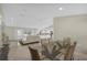 Open-concept living space flows into the dining and kitchen areas, perfect for entertaining with abundant light at 3506 Seaway Dr, New Port Richey, FL 34652