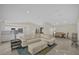 Spacious living area featuring an open layout, seamlessly integrating the kitchen, dining, and seating areas at 3506 Seaway Dr, New Port Richey, FL 34652