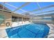 Private screened pool with mosaic tiles, perfect for outdoor entertaining or relaxing in the sun at 3506 Seaway Dr, New Port Richey, FL 34652