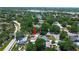 An aerial view of the home highlighting the landscaping and neighborhood streets at 3647 Lake St George Dr, Palm Harbor, FL 34684