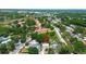 An aerial shot of the property showing proximity to neighborhood amenities and landscaped greenery at 3647 Lake St George Dr, Palm Harbor, FL 34684
