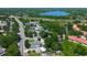 Overhead view highlighting the property's location near a lake and lush surrounding neighborhood at 3647 Lake St George Dr, Palm Harbor, FL 34684