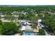 An aerial shot of the home, showcasing the backyard pool and proximity to the street at 3647 Lake St George Dr, Palm Harbor, FL 34684