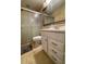 Bathroom featuring a shower, toilet, vanity and tiled floor at 3647 Lake St George Dr, Palm Harbor, FL 34684
