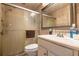 Bathroom featuring a glass shower door, toilet, sink, and framed mirror on the wall at 3647 Lake St George Dr, Palm Harbor, FL 34684
