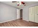This bedroom features wood floors and a closet for ample storage at 3647 Lake St George Dr, Palm Harbor, FL 34684