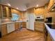 Well-appointed kitchen with light wood cabinets, modern appliances, and ample counter space for meal preparation at 3647 Lake St George Dr, Palm Harbor, FL 34684