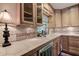 A well-lit kitchen showcasing counter space, a sink, and wooden cabinets at 3647 Lake St George Dr, Palm Harbor, FL 34684