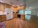 Open kitchen featuring light wood cabinets, modern appliances, and convenient breakfast bar area at 3647 Lake St George Dr, Palm Harbor, FL 34684