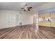 Spacious living room featuring hard surface floors, neutral walls, and an open concept to the kitchen at 3647 Lake St George Dr, Palm Harbor, FL 34684