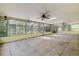 This large screened-in patio includes tile flooring, ceiling fans, and three skylights at 3647 Lake St George Dr, Palm Harbor, FL 34684