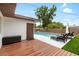 Captivating pool with an inviting deck featuring lounge chairs, complemented by lush green surroundings at 416 Graham Dr, Clearwater, FL 33765